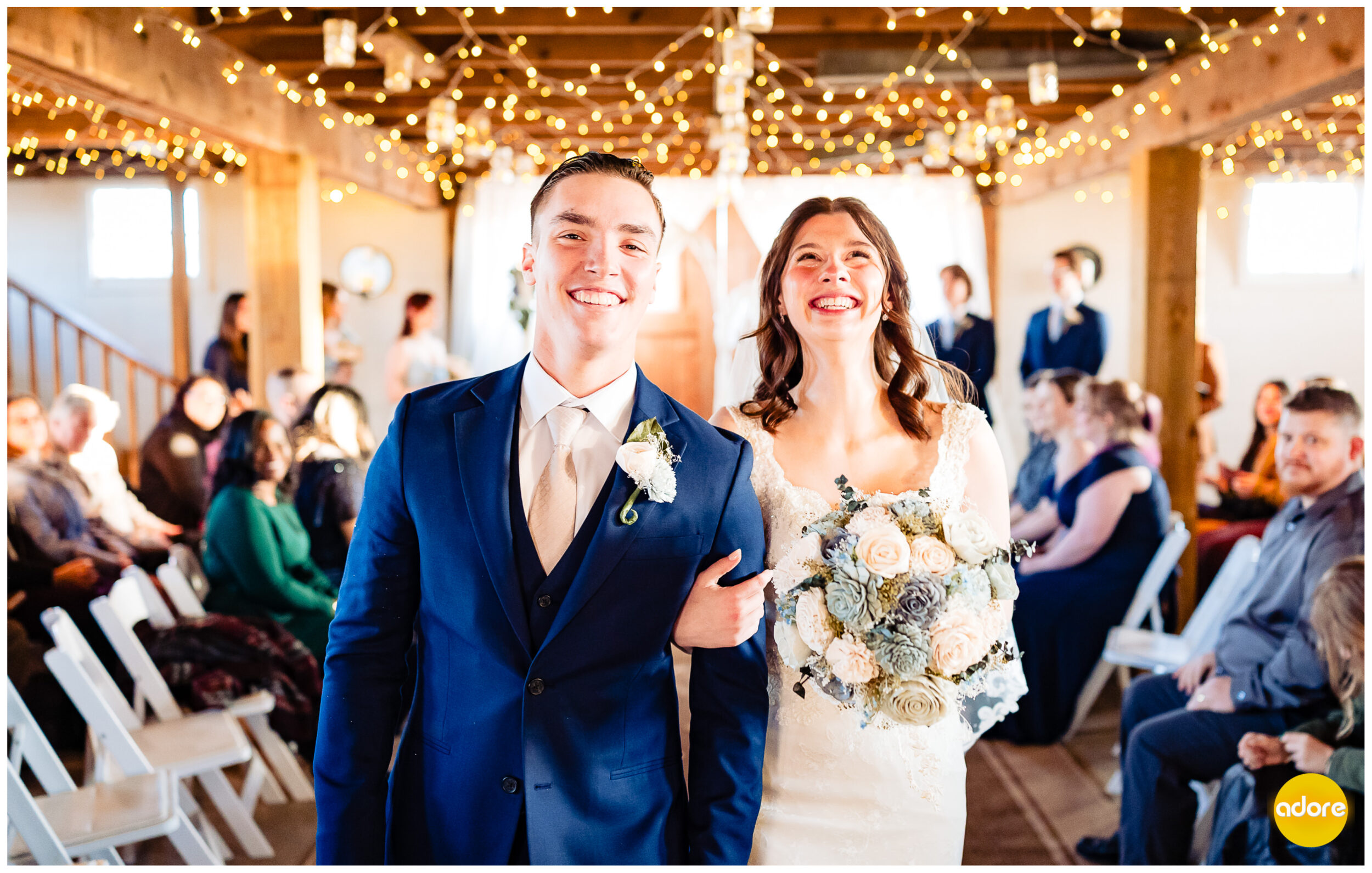 Elated bride and groom walking during processional after ceremony
Shade Rock Farms