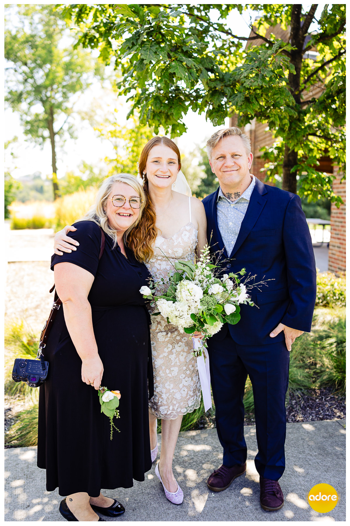 Portrait of bride and groom with Mary Beth (officiant) after wedding ceremony in Middlegrounds Metropark Toledo OH
