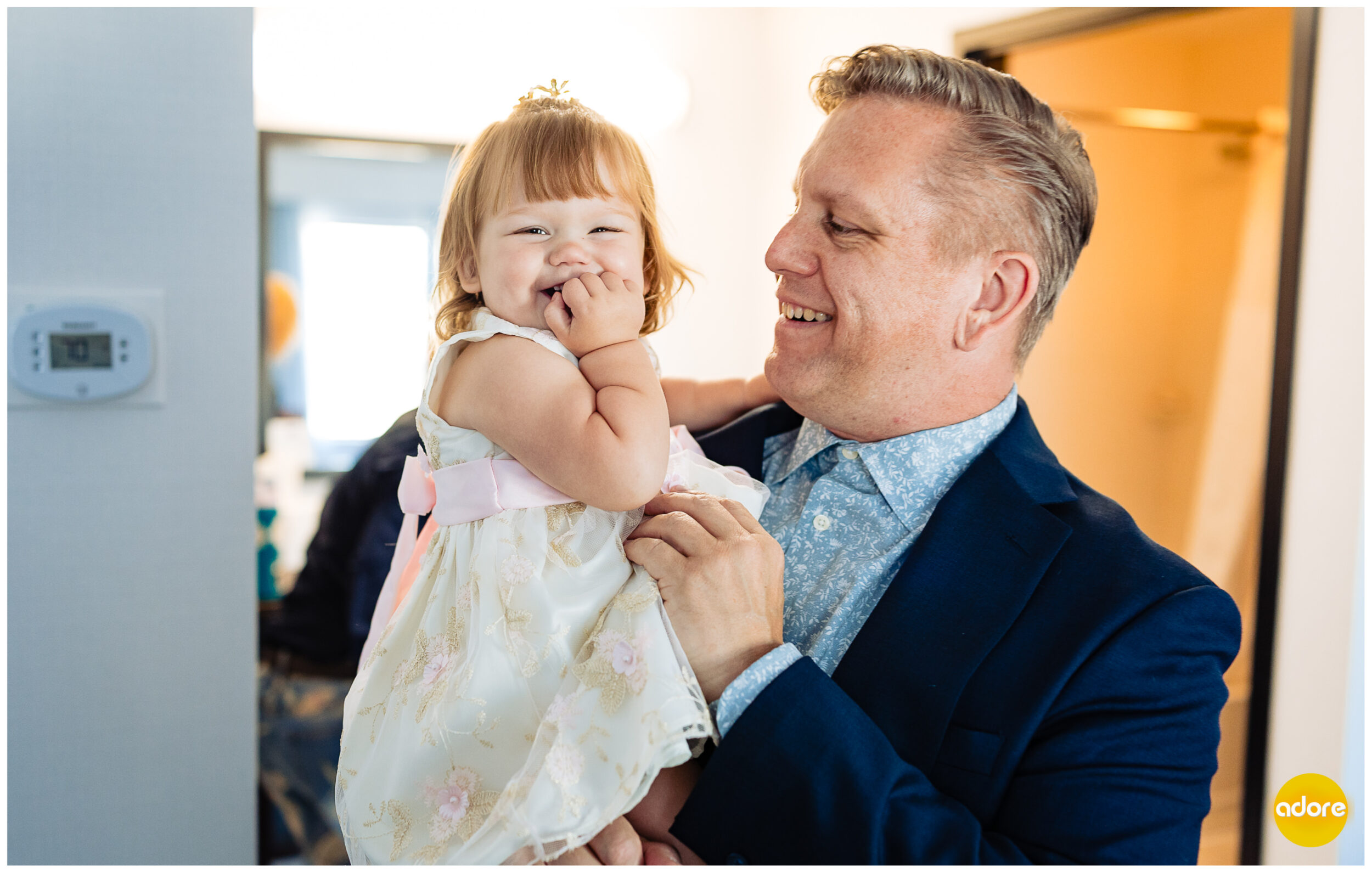 Groom with daughter on wedding day