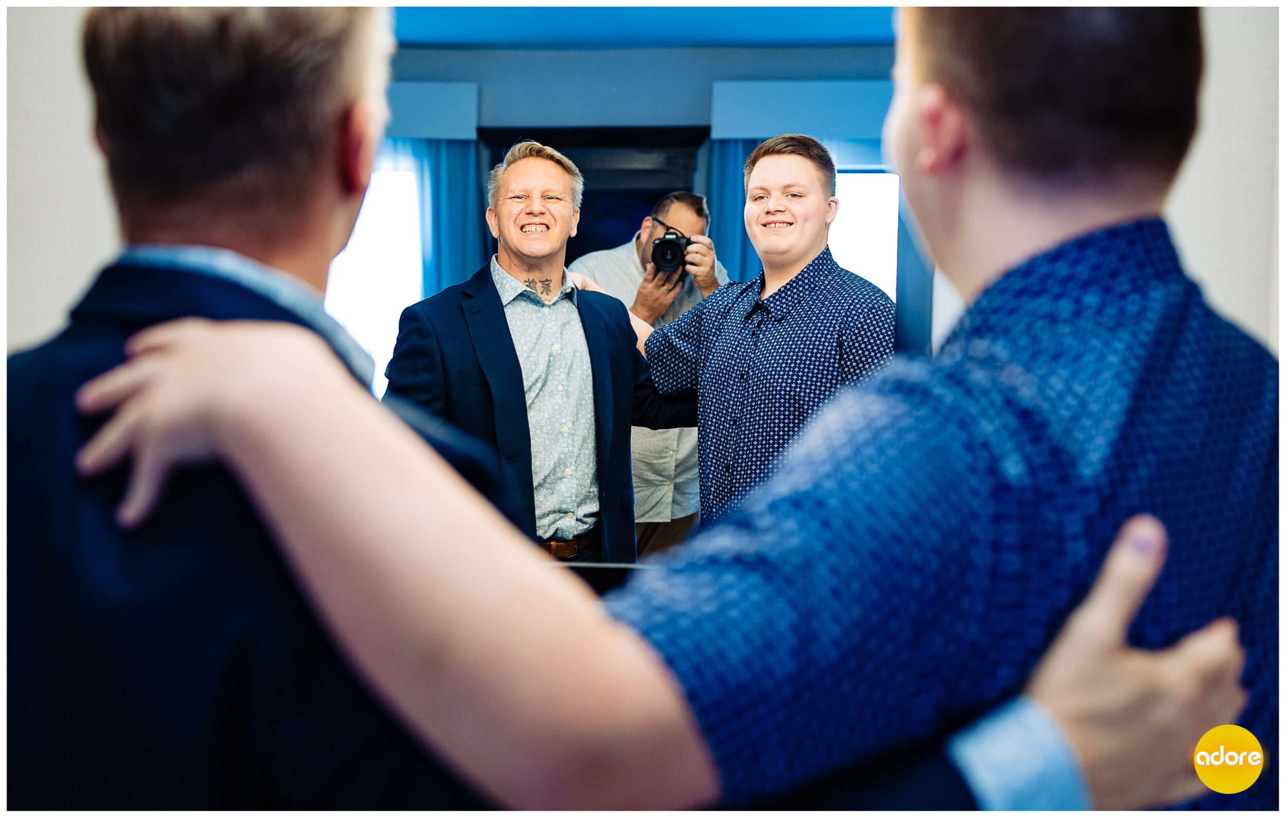 Groom with son getting ready on wedding day